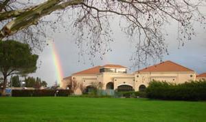 Photo of the Childrens with Rainbow in Background' Center Building